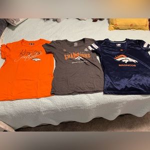 Lot of women’s Denver Bronco shirts